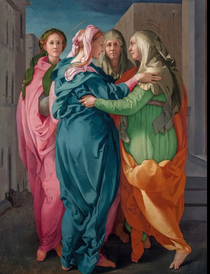 Pintura renacentista de dos mujeres abrazándose con solemnidad, en el centro de una escena arquitectónica. Los rostros muestran una mezcla de afecto y contención emocional.